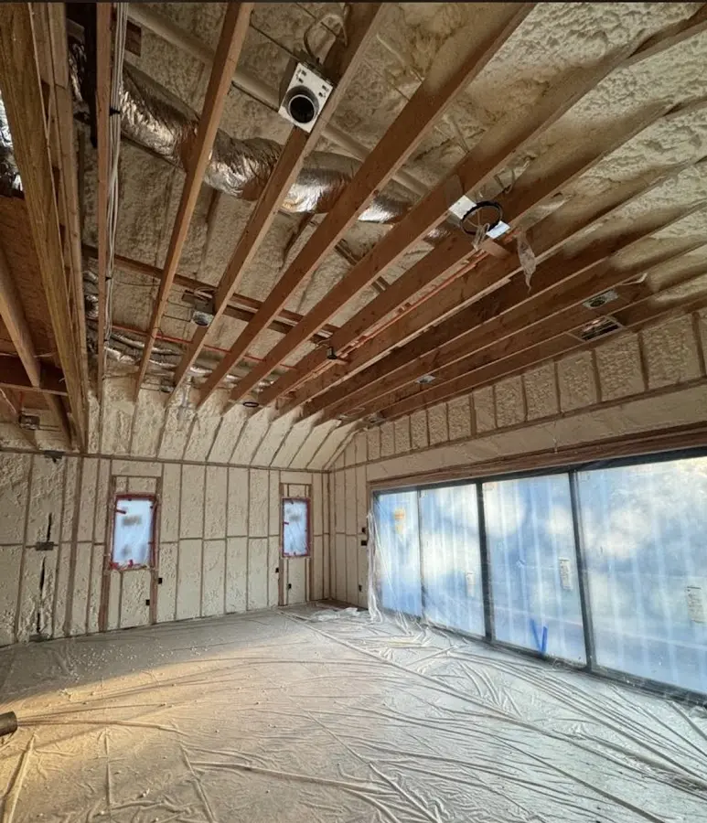 Interior walls and ceiling insulated with spray foam during new construction in Hickory Creek